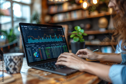 A dynamic collaboration between technology and financial advisory service, with charts and columns on laptop screen at cafe