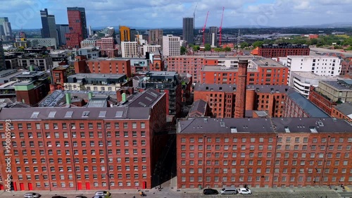 Aerial view of Manchester cityscape with mix of old cotton mills and new buildings, rochdale canal. photo