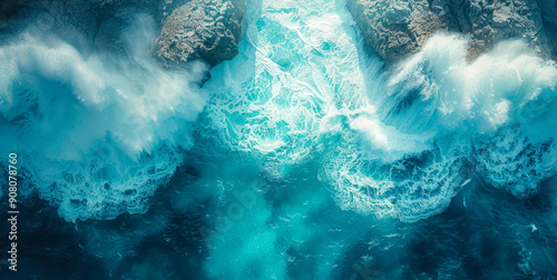 Aerial View of Powerful Crashing Sea Waves Over Rugged Ocean Rocks on Sunny Day with Turquoise Waters and Coastal Erosion Theme