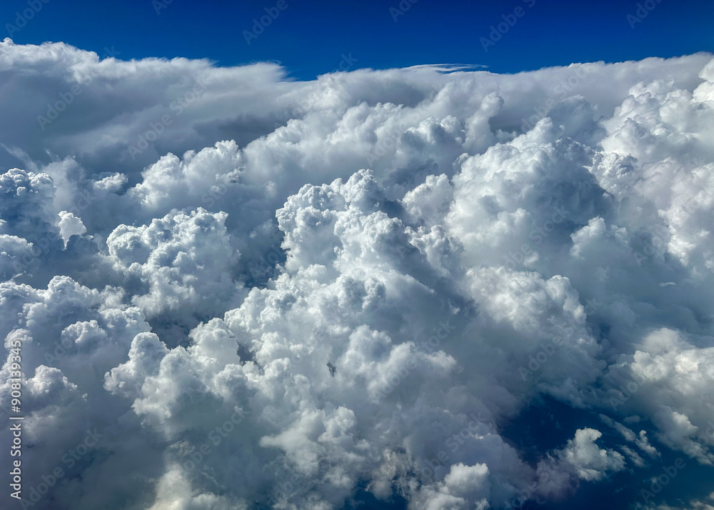 Aerial view of fluffy white clouds and blue sky Aerial view of fluffy white clouds and blue sky