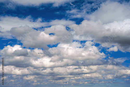 Blue sky with clouds of different shapes. Cloudy overcast sky.