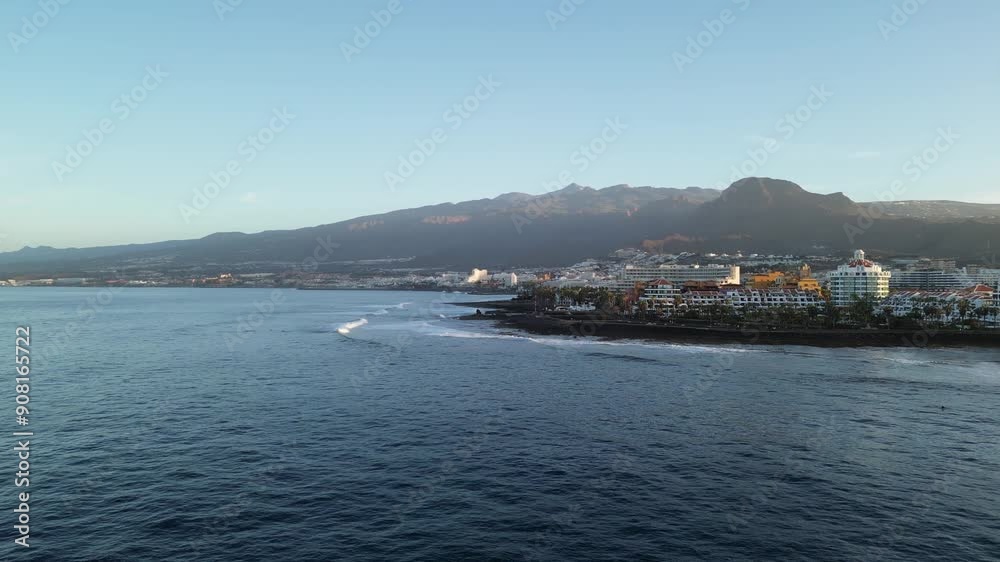 Pan shot flight with panorama of Atlantic Ocean, hotel resorts of Playa de las Americas, beach and volcano Teide on Canary Island Tenerife, Spain Pan shot flight with panorama of Atlantic Ocean, hotel resorts of Playa de las Americas, beach and volcano Teide on Canary Island Tenerife, Spain