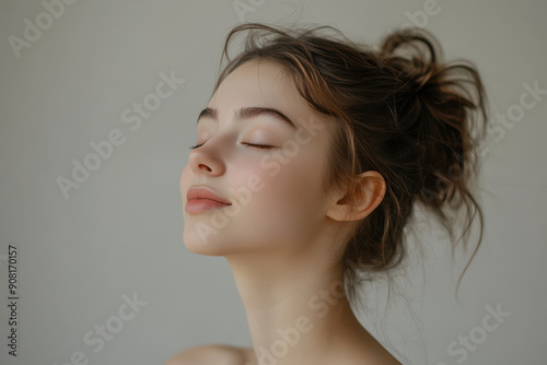 A close up of a girl's face with her eyes closed