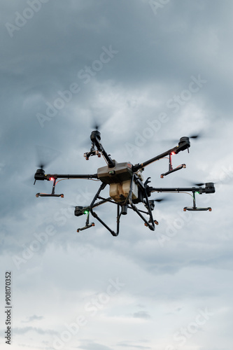 Agrodrone sprayer sprays sunflower fields, precision farming, the latest agriculturethe. Drone - new technology in farming.