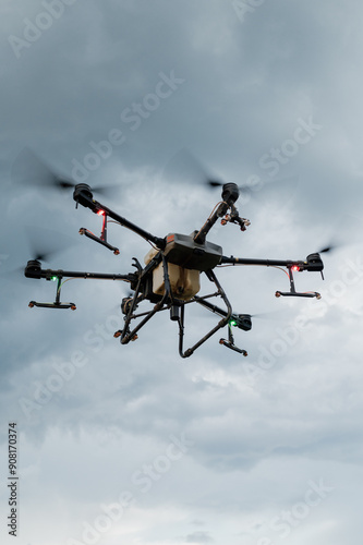 Agrodrone sprayer sprays sunflower fields, precision farming, the latest agriculturethe. Drone - new technology in farming.