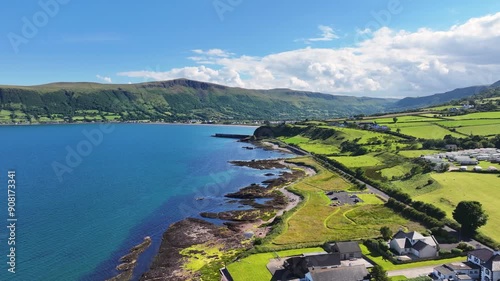 Aerial View of the picturesque landscape of the coast of Ireland on a sunny day with a blue sky photo