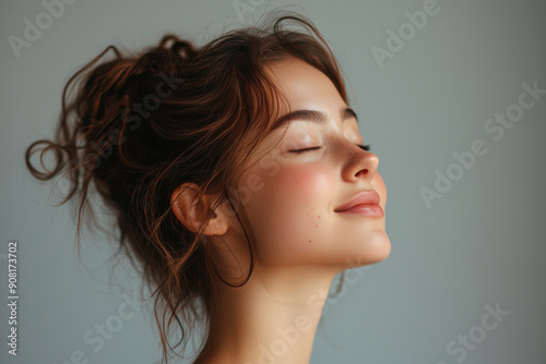 A close up of a girl's face with her eyes closed