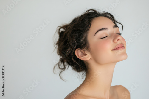 A close up of a girl's face with her eyes closed