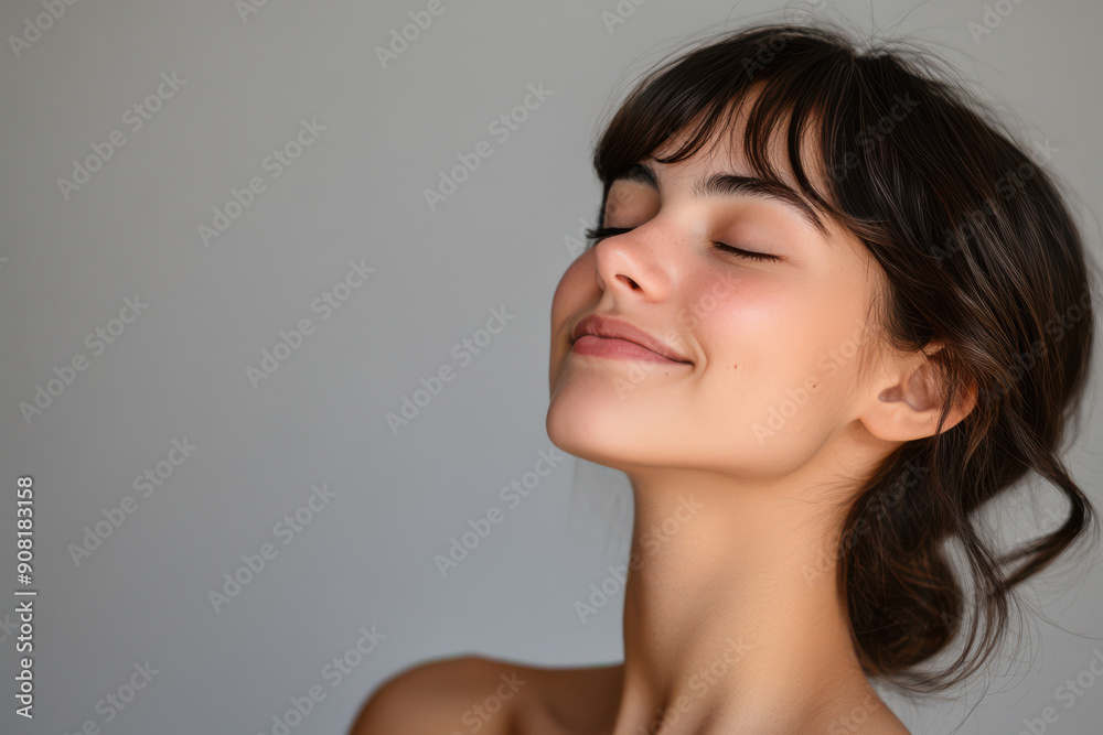 A close up of a girl's face with her eyes closed A close up of a girl's face with her eyes closed