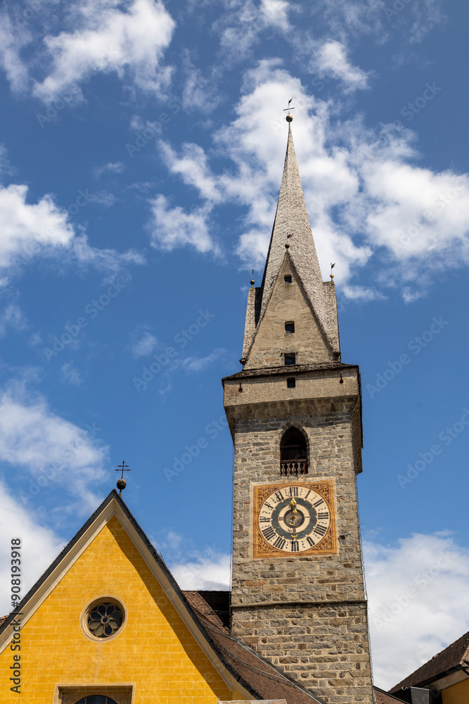 Brunico (BZ), August 03, 2024. Bell tower of the Ursulinen Holy Saviour church in the historic city of Bruneck or Brunico, South Tyrol, Italy Brunico (BZ), August 03, 2024. Bell tower of the Ursulinen Holy Saviour church in the historic city of Bruneck or Brunico, South Tyrol, Italy