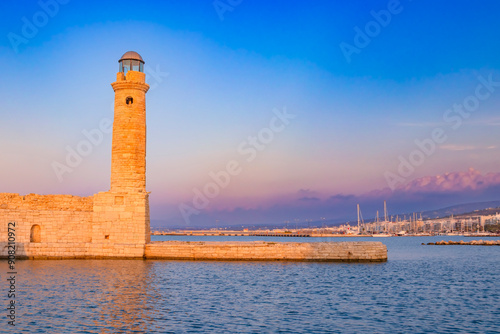 Old lighthouse at port of Rethymno town, Crete island, Greece. photo