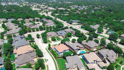 Cul-de-sac keyhole shape street in quite residential neighborhood upscale mansion houses with swimming pool, well-trimmed landscape in Coppell, Dallas suburbs DFW Metroplex, Texas, aerial view photo
