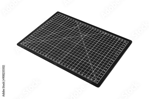 A black cutting mat with a white grid is isolated on transparent background.