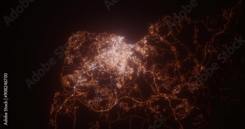 Tangier (Morocco) aerial view at night. Satellite view on modern city with street lights. Camera is flying above the city, moving forward