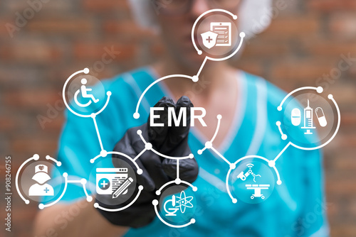 Nurse using virtual touch screen presses text: EMR. Electronic medical or health record ( EMR or EHR ). Medicine, insurance, digital healthcare and medical document management online system concept. photo