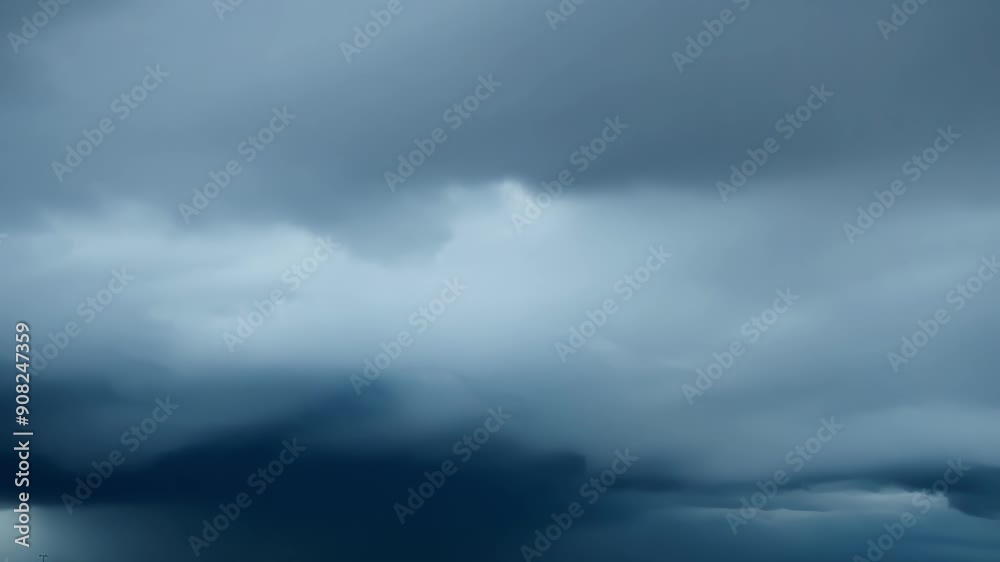 Swirling rapidlymoving storm clouds create a sense of urgency and danger hinting at the intensity of the coming storm. Swirling rapidlymoving storm clouds create a sense of urgency and danger hinting at the intensity of the coming storm.
