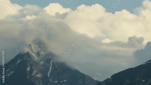 The clouds seem to play hide and seek with the mighty mountain peaks at times engulfing them completely and then revealing their splendor again.