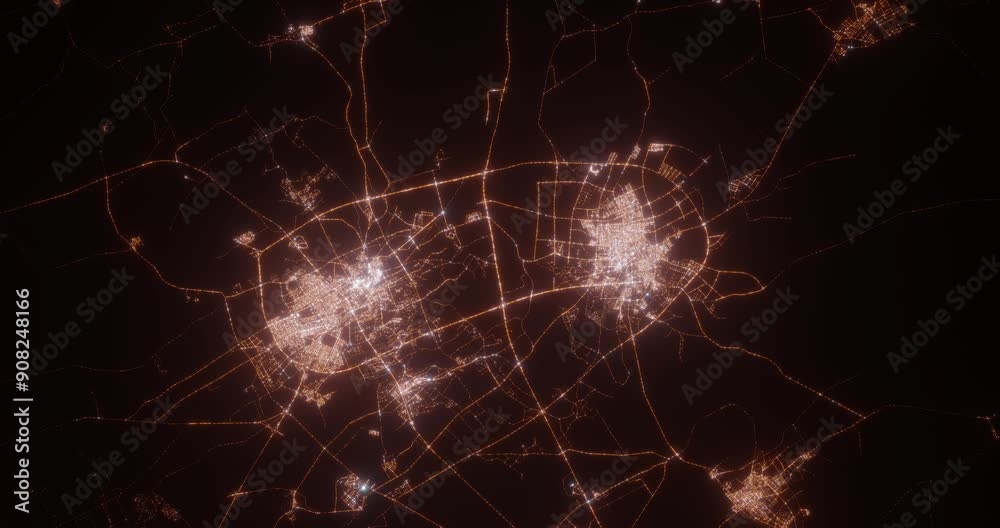 Buraydah and Unaizah (Saudi Arabia) top view at night. View on modern city from satellite. Camera is zooming in, rotating counterclockwise. Vertical video. The north is on the left side