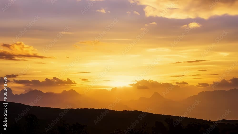 Standing tall against the fading light the golden clouds shine with a radiant warmth. Standing tall against the fading light the golden clouds shine with a radiant warmth.