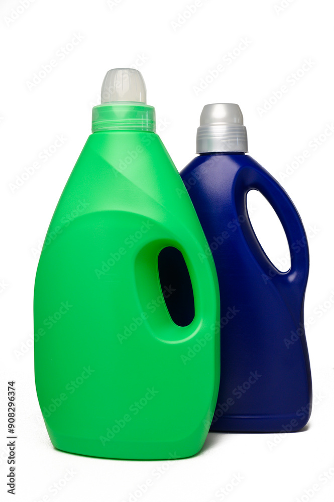 Blue and green bottles of washing powder on white background. It has a white sticker for your image and text.