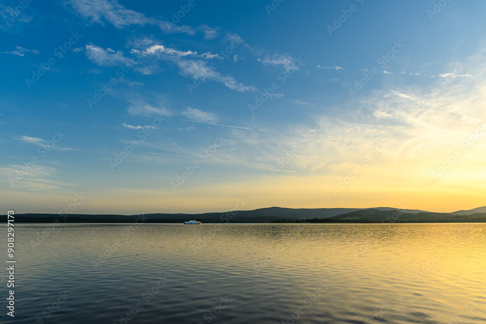 Romantic summer sunset on the beach by the lake Romantic summer sunset on the beach by the lake
