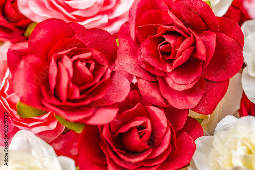 Fototapeta Naklejka Na Ścianę i Meble -  Pink, red and white artificial roses.
Image of rose flowers.
