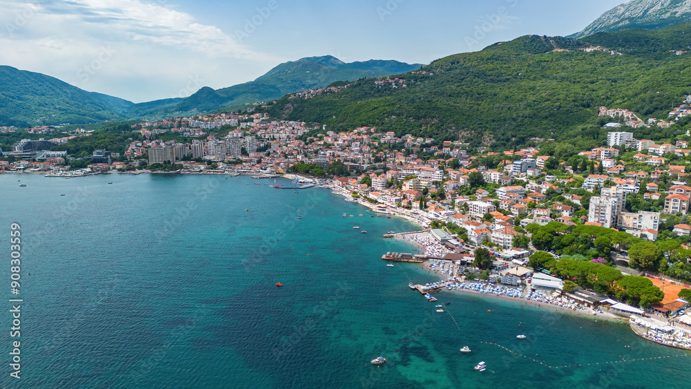 Fototapeta premium Aerial view of a waterfront residential area in Igalo on the coast of the Adriatic Sea in the Bay of Kotor in Montenegro