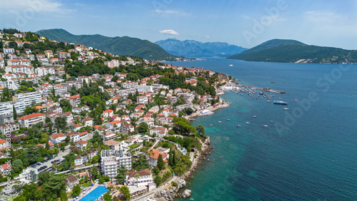 Aerial view of a waterfront residential area in Herceg Novi on the coast of the Adriatic Sea in the Bay of Kotor in Montenegro photo