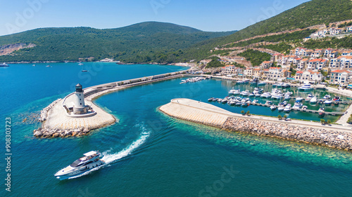 Aerial view of Lustica Bay, a new luxury resort along the coast of the Adriatic Sea in Montenegro - Exclusive marina for private yachts with a jetty ended by a lighthouse in the Mediterranean photo