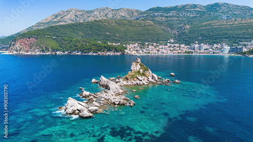 Aerial view of the Sveta Neđelja islet and its small hilltop church off the coast of Petrovac na Moru, a resort town by the Adriatic Sea in Montenegro photo