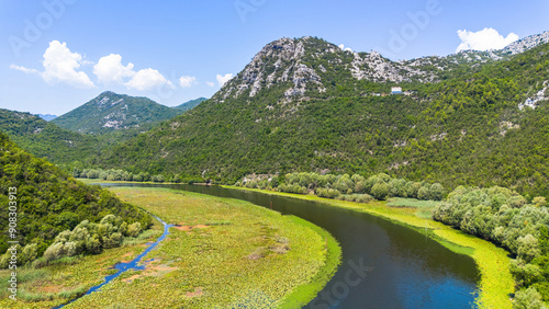 Aerial view of the winding Rijeka Crnojevića (River of Crnojević) flowing in the mountains near the Lake Skadar in Montenegro photo