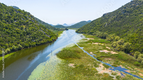 Aerial view of the winding Rijeka Crnojevića (River of Crnojević) flowing in the mountains near the Lake Skadar in Montenegro photo