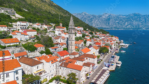 Aerial view of the town of Perast with the belfry of the St Nicholas church on the coast of the Adriatic Sea in the Bay of Kotor, Montenegro