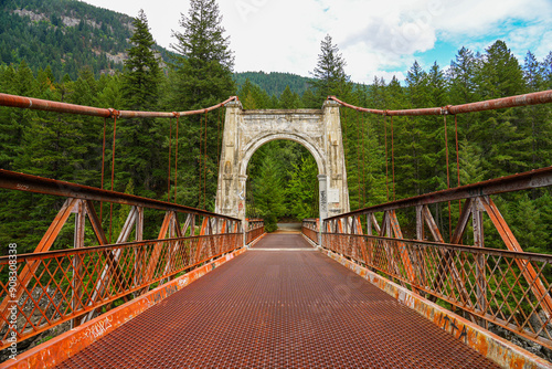 Second Alexandra Bridge, a suspension bridge opened in 1927 spanning the Fraser River within the lower Fraser Canyon of British Columbia, Canada photo