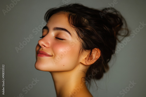 A close up of a girl's face with her eyes closed