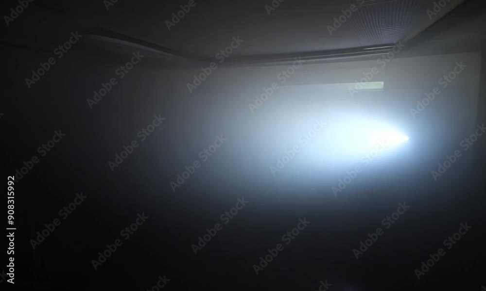 A Single Beam of Light Piercing Through the Darkness: A solitary beam of light illuminates a dark, foggy room, creating a sense of mystery and intrigue. The light acts as a beacon of hope, symbolizing