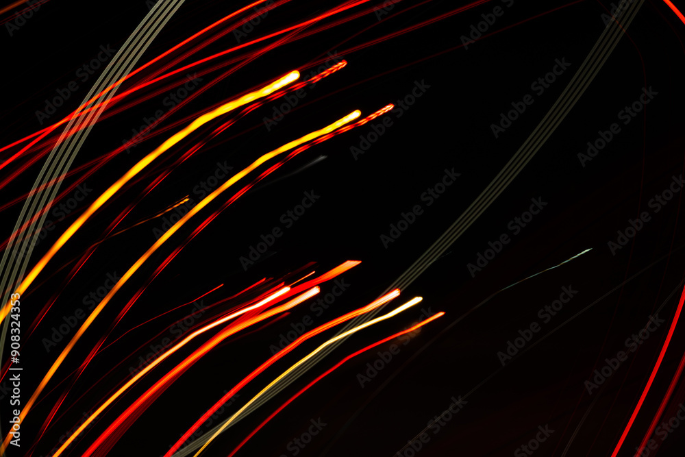 A black and orange background with red and yellow lines. The lines are blurry and overlapping, creating a sense of movement and energy. The image conveys a feeling of excitement and motion A black and orange background with red and yellow lines. The lines are blurry and overlapping, creating a sense of movement and energy. The image conveys a feeling of excitement and motion