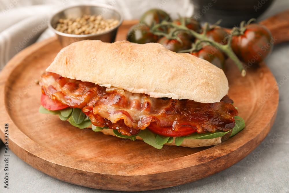 Tasty sandwich with bacon on grey table, closeup Tasty sandwich with bacon on grey table, closeup