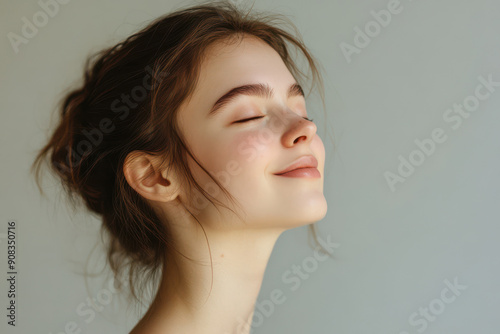 A close up of a girl's face with her eyes closed