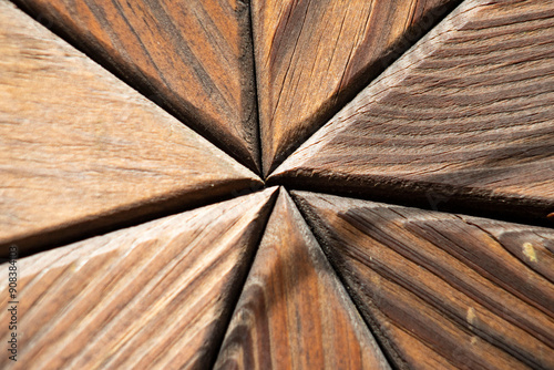 pieces of wood radiating from the center of the photo, close up wood grain, imperfect center