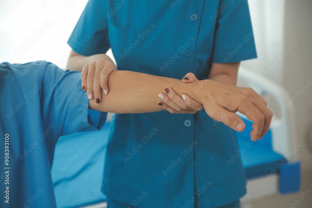 Physiotherapist man giving exercise with dumbbell treatment About Arm and Shoulder of athlete male patient Physical therapy concept Physiotherapist man giving exercise with dumbbell treatment About Arm and Shoulder of athlete male patient Physical therapy concept