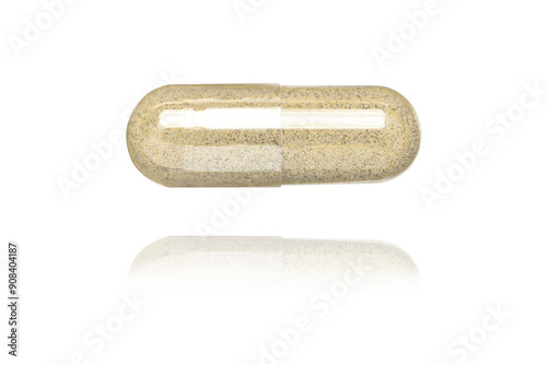 brown medicine capsule on white