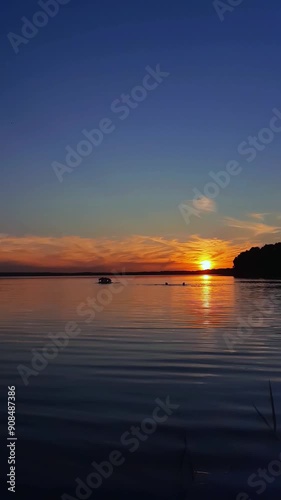 sunset over the lake. vertical