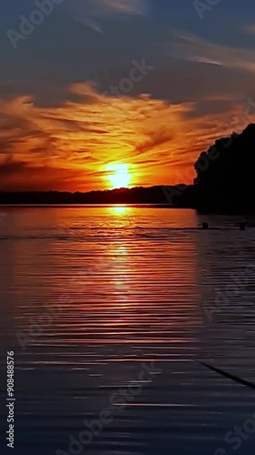 sunset on the lake. vertical