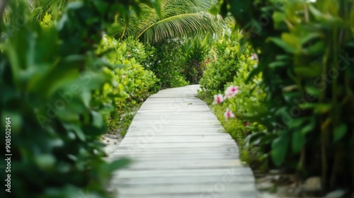 A serene wooden pathway meanders through a lush tropical garden filled with vibrant green plants and colorful blooms