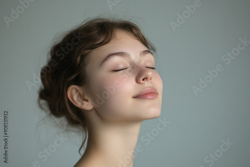 A close up of a girl's face with her eyes closed