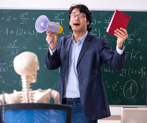 Young male math teacher and student skeleton