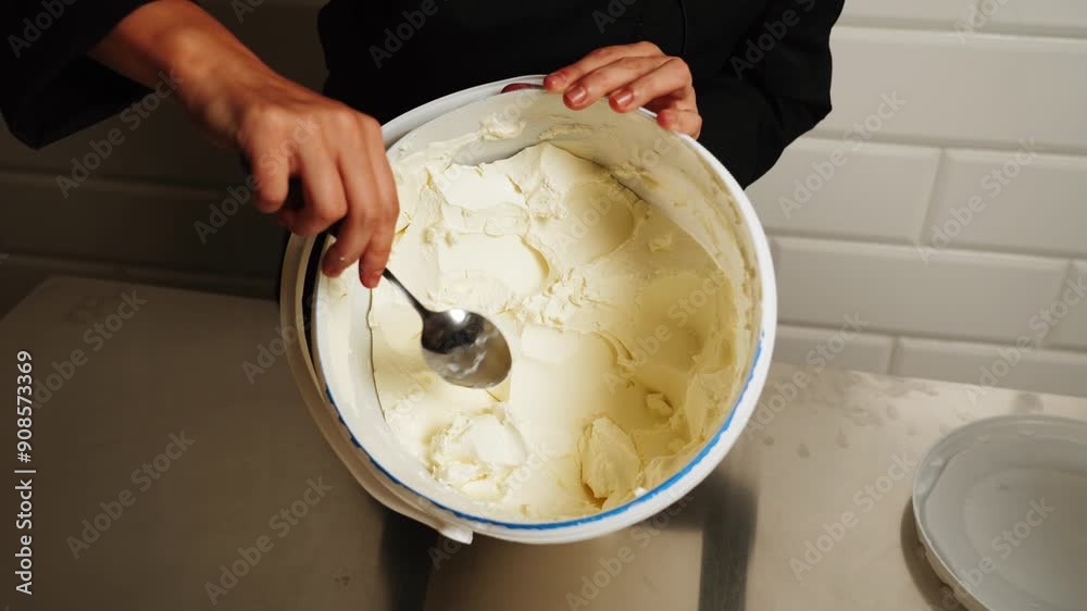 The process of making vanilla cream cheese. Cream for cakes. The concept of making confectionery and cakes