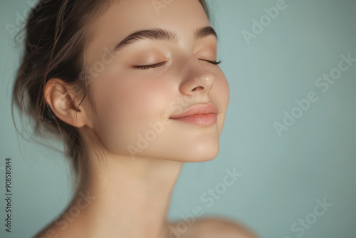 A close up of a girl's face with her eyes closed