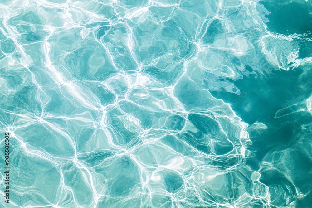Obraz premium Calm turquoise water with gentle ripples and reflections, evoking a serene and refreshing atmosphere. 